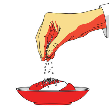Hand sprinkling seeds onto food in a red bowl, white background