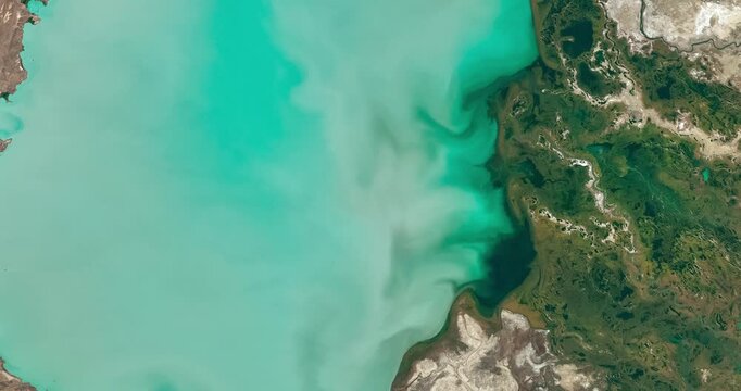 Panoramic shot on salt lake, azure water. Camera is moving forward and left. Animation based on image by NASA