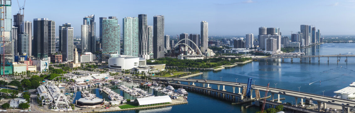 Aerial view of Downtown Miami skyline with modern skyscrapers, the marina, and bridges over Biscayne Bay in Miami, Florida, United States.