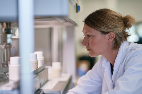 A scientist examines various samples in a modern laboratory, showcasing innovation, precision, and the persistent pursuit of knowledge in the scientific field.