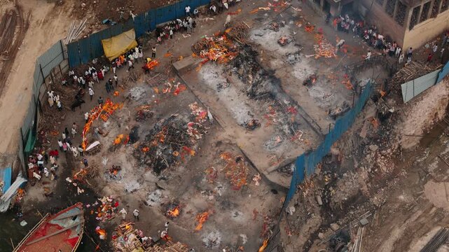 Aerial view of hindu funeral ceremony with burning pyres at manikarnika ghat in varanasi, india. Cremation ceremony