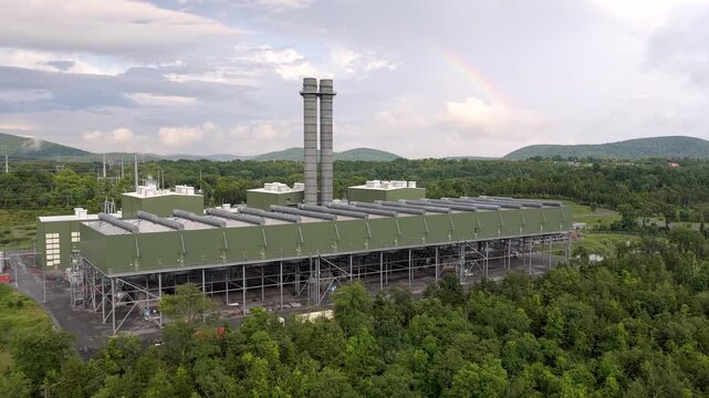 Cricket Vally Energy featuring the facility's twin exhaust stacks, air-cooled condenser system and industrial infrastructure surrounded by the wooded landscape. Aerial view