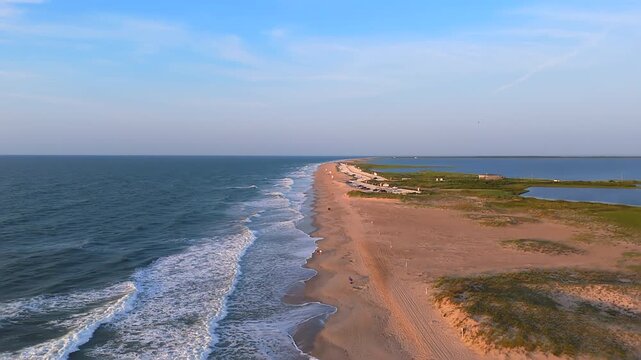 Foamy Waves Coming To The Sandy Shore Of Beach. - aerial pullback shot