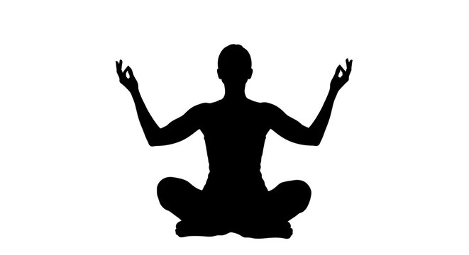 Black silhouette of a person sitting in a yoga pose