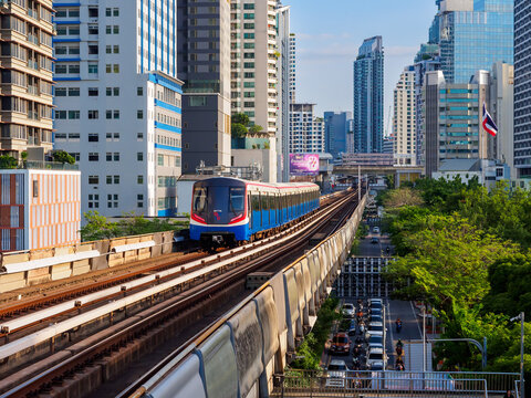 Bangkok, Thailand - July 8, 2026 : The BTS Skytrain runs in and out of Victory Monument Station in the afternoon, showing the other side of the station.