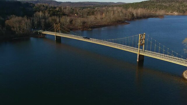 Aerial view of the sunrising on Beaver bridge with pickup truck traversing the bridge
