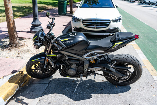 Miami, Florida, USA - May 07, 2025: Triumph Street Triple 765 RS sport bike. Triumph sport bike motorcycle. Parked Triumph street triple 765 RS outdoor. Black motorbike, side view