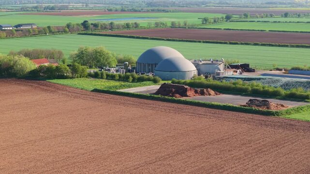 Aerial view of biomass renewable energy power plant surrounded by colourful rural fields in Lincolnshire UK