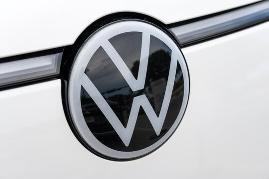 Miami, Florida, USA - May 24, 2025: Volkswagen ID Buzz 2022 electric minivan car. Luxury electric minivan car Volkswagen ID Buzz. Car Volkswagen ID Buzz parked outdoor. Yellow car, logo sign view.