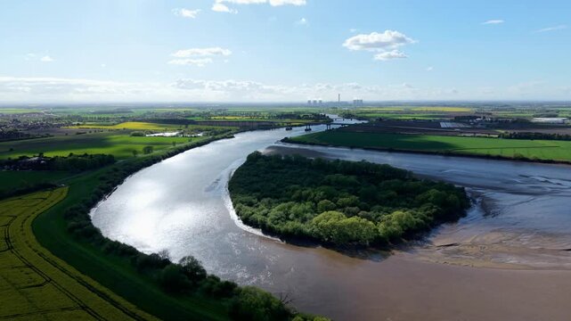 High angle aerial view of isolated wildlife sanctuary and silt river channel near Goole and Howden