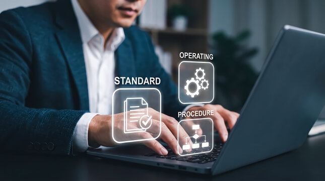 Businessman using laptop with standard operating procedure sop icon hologram for workflow business process optimization and quality control