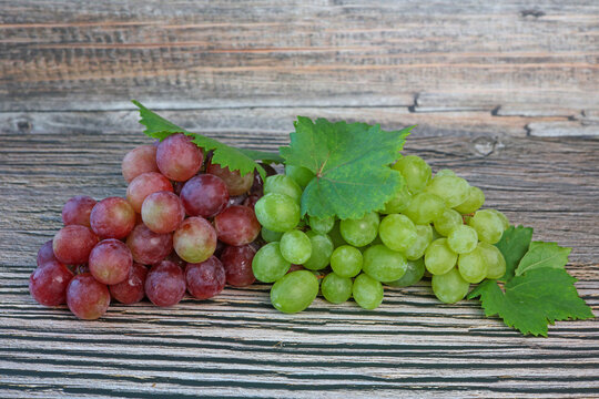 fresh bunch of grapes on wooden background