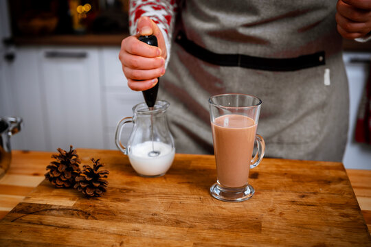 Joyful christmas cooking and domestic new year winter lifestyle, frothing milk for warm holiday hot chocolate beverage, creating cozy comforting xmas drinks and authentic atmosphere