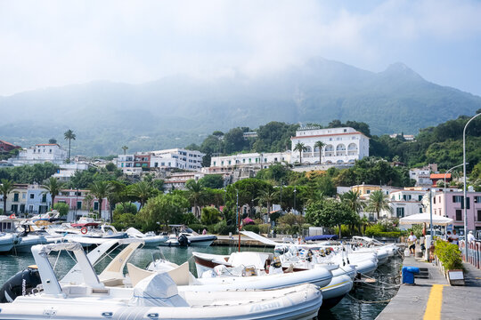 Ischia, Italy - August 7, 2026. Marina of Casamicciola Terme with Boats and Hillside Architecture in Ischia. A picturesque morning view of the harbor and marina at Casamicciola Terme on the northern c