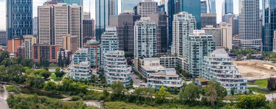 aerial view of central part of Downtown Calgary ( Alberta, Canada) with Skyline, many skyscrapers build next to each other as well as apartment complex next to Bow River