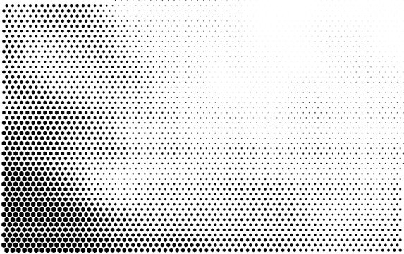 Abstract halftone background with black hexagonal dots fading into white gradient pattern