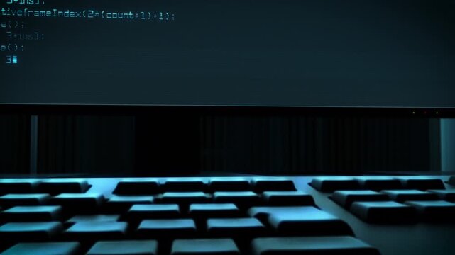 自動でタイピングしているキーボードとPCモニターの3Dアニメーション　架空のコード表示