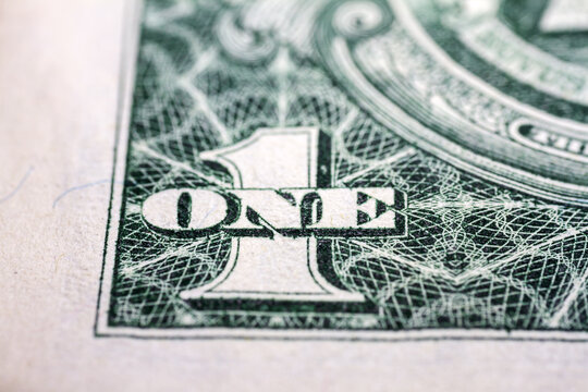 Macro close up of United States one dollar bill. American dollar background. Detailed dollars money texture. Selective focus, shallow depth of field