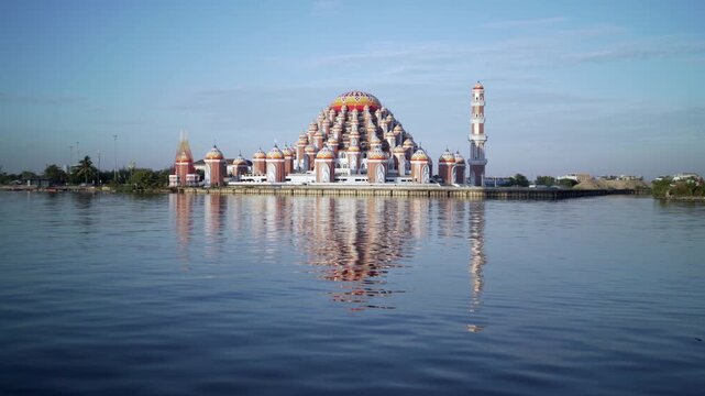 an icon of makassar city called "masjid 99 kubah" on the lossari beach