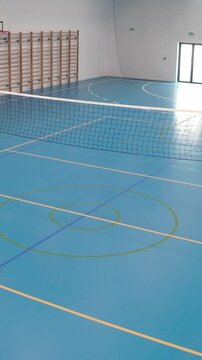 Empty school gymnasium sports flooring court