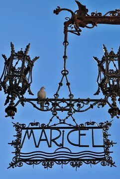 Maricel Museum wrought iron sign with dove perched. Tarragona - Spain