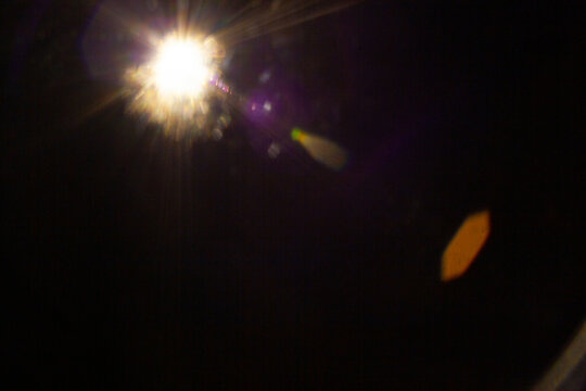 Sun flare on the black background