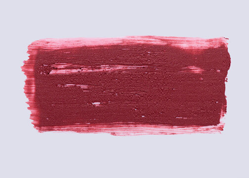 Large lipstick smear covering light background