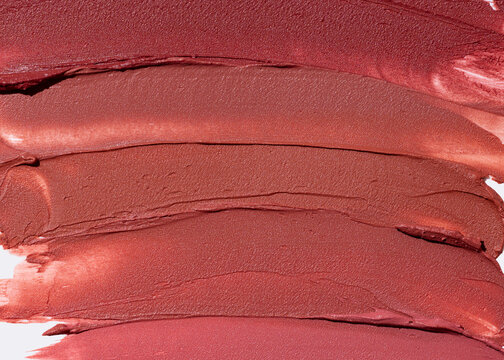 Close up lipstick texture on light surface