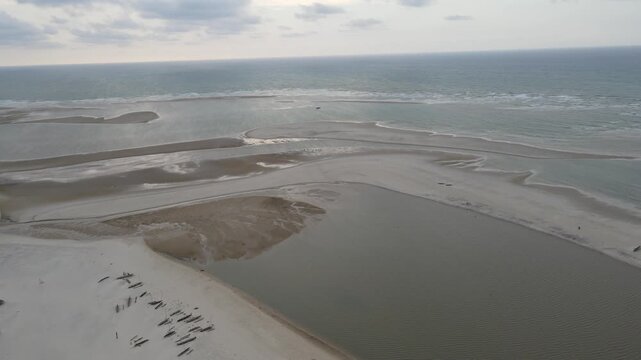 Drone view of the beach and ocean with sandbacks in Morondava, Madagascar