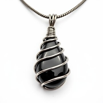 Spiral wire wrapped hematite pendant with polished silvery black stone on white background for jewelry design and accessories themes