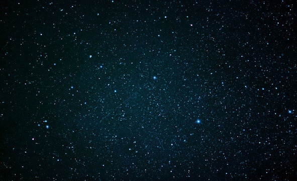 Night sky with shining stars and a galaxy in space.