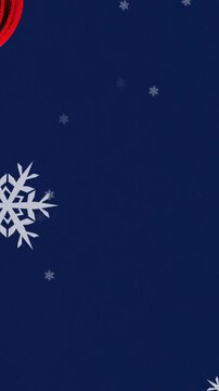 Animation of snow falling over christmas bauble decorations on navy background