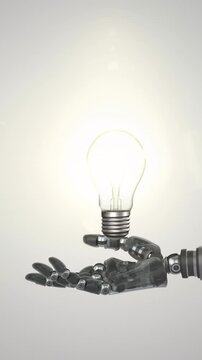Animation of illuminated light bulb over hand of extended robot arm, on grey background