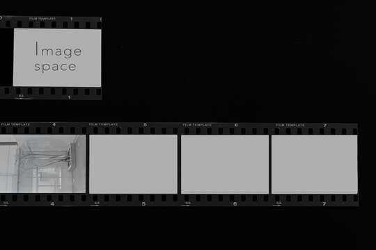 set of realistic 35mm photographic film strip negative templates isolated on a solid black background.