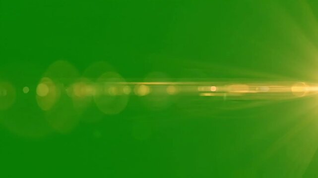 Bright optical lens flare light leak sweeping horizontally on dark bac