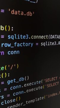 Python programming code scrolling on a computer screen for a web application development process, showcasing backend development with flask framework and sql database interaction