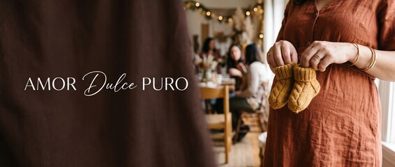 Fototapeta premium Pregnant woman holding baby booties at cozy baby shower party with friends in warm indoor setting, expecting mother celebrating new life and motherhood concept with copy space and rustic decor.