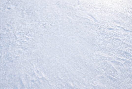 Fresh Snow Texture Background with Soft Winter Sunlight and Copy Space