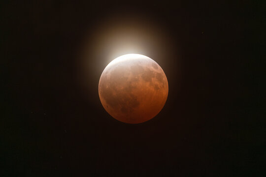 Lunar eclipse glowing in space