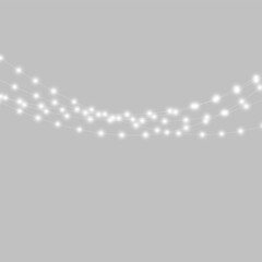 Naklejka premium Strings of soft glowing white lights hang delicately against a deep black background. The bulbs are evenly spaced along curving thin wires with a luminous halo effect.