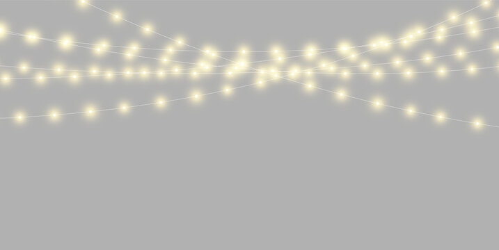 A cluster of warm yellow fairy lights glowing softly in a dark space. The lights are strung horizontally in multiple parallel lines with a slight diagonal tilt.