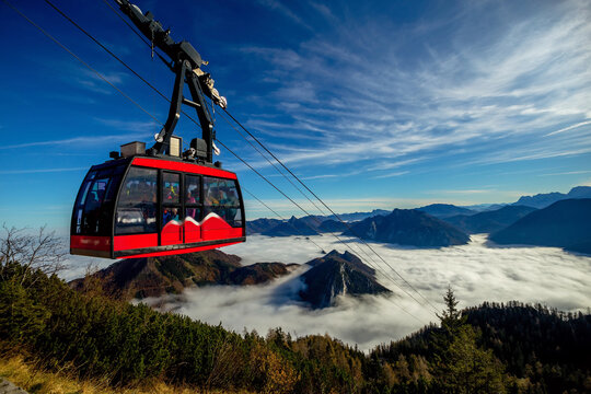 Feuerkogel cable car above Lake Traunsee rising over the autumn inversion in the Austrian Alps