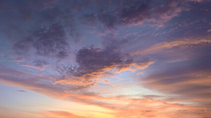 Fototapeta premium Dramatic Sunset Sky with Glowing Orange Clouds and Beautiful Blue Evening Light