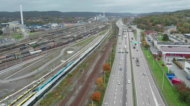 E20 Highway and Savenas train maintenance depot in Gohtenburg, Aerial Pullback