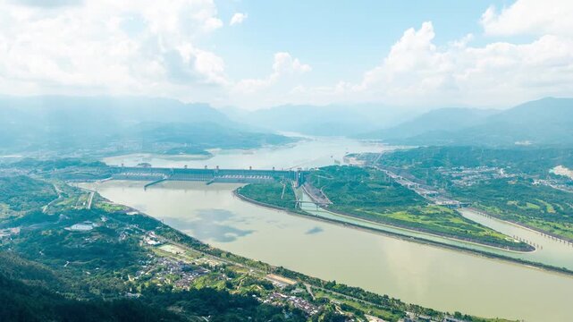 Aerial view of the Three Gorges Dam scenic area spanning across the Yangtze River in China under a bright summer sky