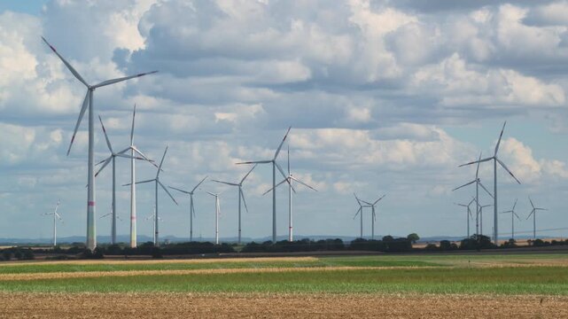 wind turbines in countryside in summer 4K