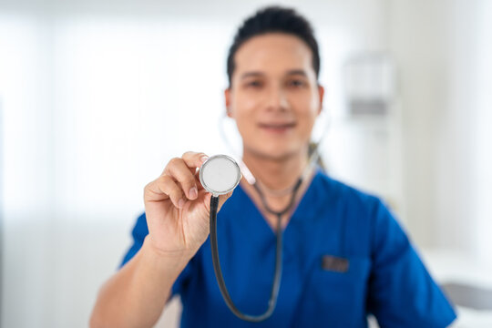 Close Up of a Doctor Holding a Stethoscope in a Medical Setting.