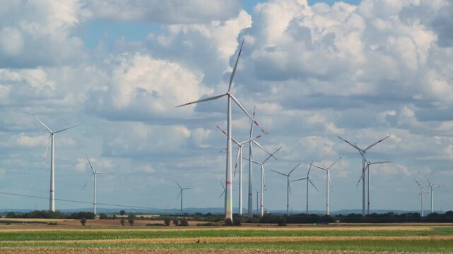 wind turbines in countryside in summer 4K