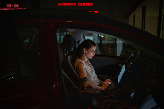 Mobile office setup in parked vehicle after hours