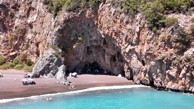 Aerial View of Rocky Cave Beach and Seaside Camping in Evia, Greece